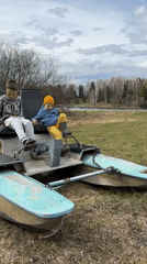 Children play near lakeside in Альняш, Russia