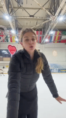 Women ice skating, filming videos at Tbilisi indoor rink