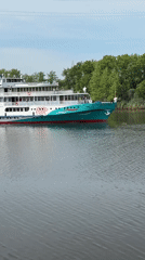 Passenger riverboat transits lock system in Chaikovsky, Russia