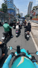 Morning rush hour traffic captured on scooter in Vietnam