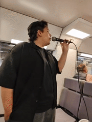 Street performers sing on Barcelona train