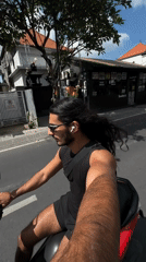 Man films himself while riding scooter in North Kuta