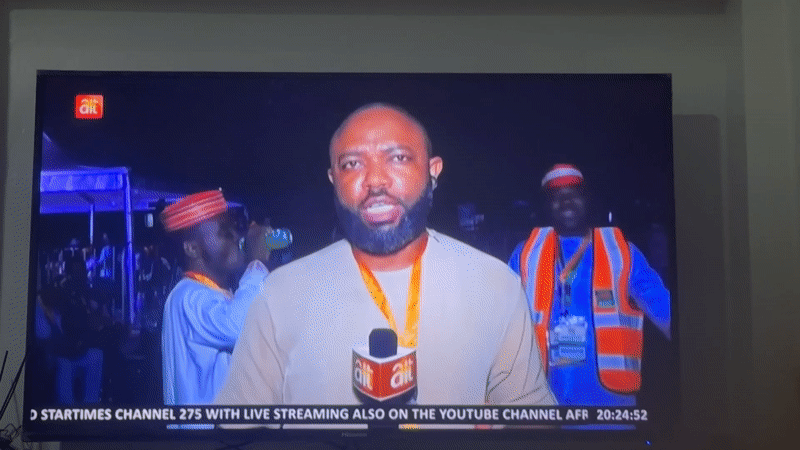 News reporter broadcasts from Gwarinpa, Nigeria with ALT microphone