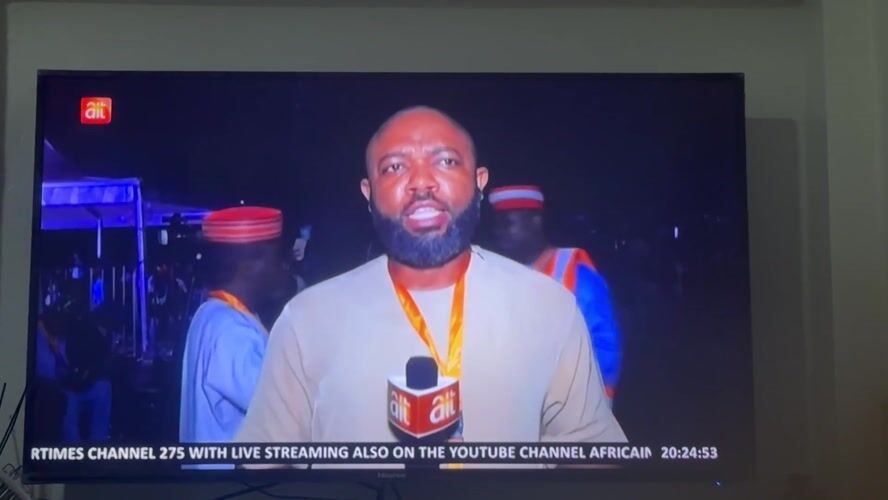 News reporter broadcasts from Gwarinpa, Nigeria with ALT microphone