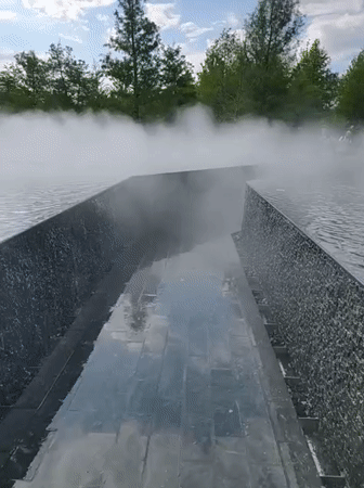 Visitors enjoy tiered waterfalls and mist fountains at Krasnodar park