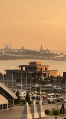 City skyline and sports complex at golden hour
