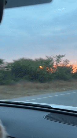 Sunset drive captured on rural Morocco road near Ghmate