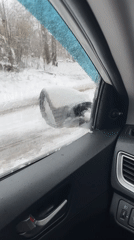 Driver documents winter road conditions in rural Russia