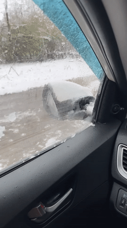 Driver documents winter road conditions in rural Russia