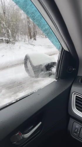 Driver documents winter road conditions in rural Russia