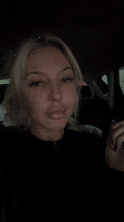 Woman filmed in dimly lit car in Bulgarian village
