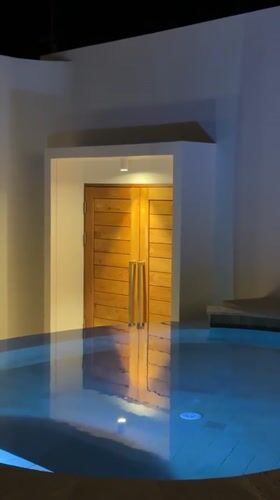Illuminated pools captured at night in Baan Tai, Thailand