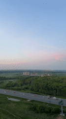 Evening traffic, construction activity observed in Kudrovo, Russia
