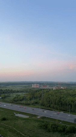 Evening traffic, construction activity observed in Kudrovo, Russia