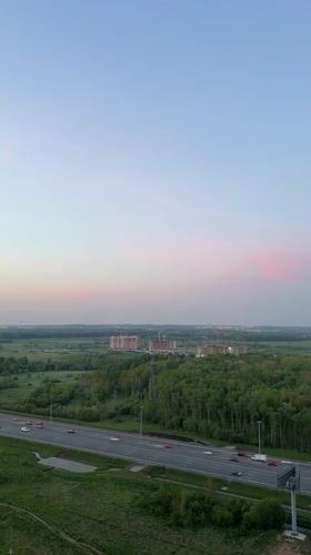Evening traffic, construction activity observed in Kudrovo, Russia
