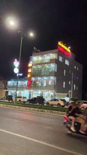 Nighttime street scene recorded at Vietnamese seafood restaurant
