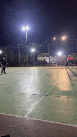 Floodlit outdoor court glows at night in Iquique