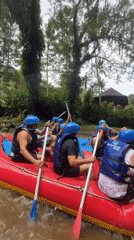 River rafting group navigates muddy waters in Ubud Indonesia