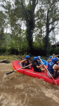 River rafting group navigates muddy waters in Ubud Indonesia