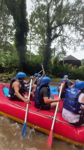 River rafting group navigates muddy waters in Ubud Indonesia