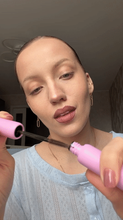 Woman documents morning makeup routine in Reshetnikovo, Russia