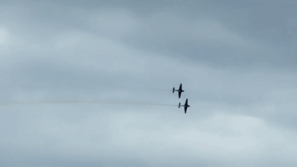 Biplane formation display over Southport with smoke trails