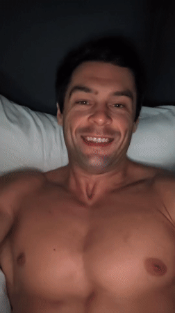 Shirtless man recorded posing, flexing in Moscow bedroom