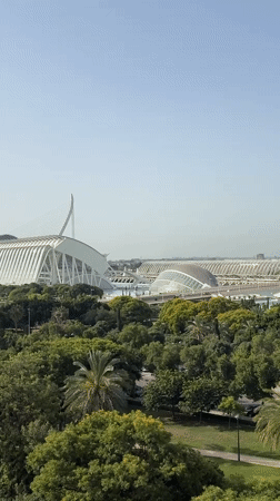 City of Arts and Sciences framed by green parkland on a sunny morning