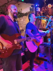 Live music and busy streets in Kuşadası on a summer evening