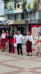 Cultural festival with singing, dancing, archery in Russian town square