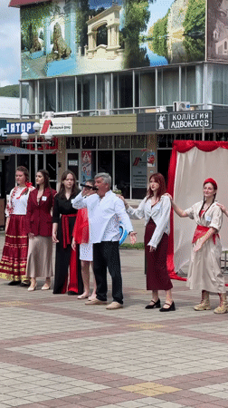 Cultural festival with singing, dancing, archery in Russian town square