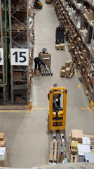 Evening warehouse shift documented during routine box handling operations