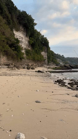 Sunset light and tide pools on a Kuta Selatan rocky shore