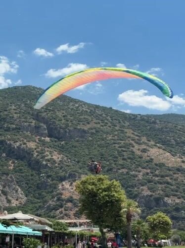 Paragliders fill the skies above Fethiye on a clear morning