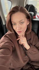 Woman films selfie video from car backseat in Russia