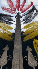 Ornate metallic structure with Arabic script and feathers, Babol