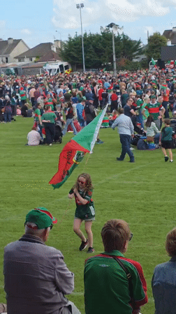 Green and red faithful pack Claremorris for outdoor celebration and live music