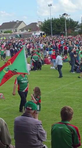 Green and red faithful pack Claremorris for outdoor celebration and live music