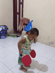 Toddler moves between play and prayer at home in Blang Cut