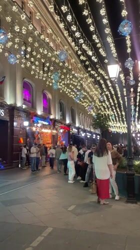 Moscow pedestrian street buzzing on a summer night