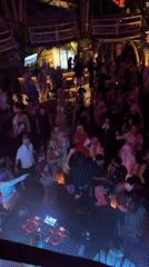 Laser lights, DJ sets, and dancing at a Kediri night event