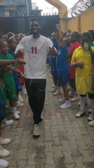 School children participate in morning exercise activities in Nigeria
