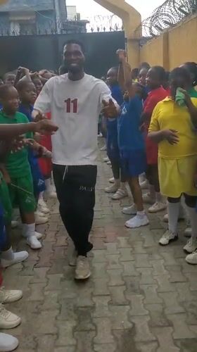 School children participate in morning exercise activities in Nigeria