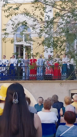 Folk choir performs traditional songs from balcony in Orenburg