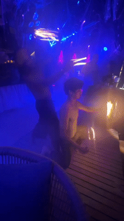 Fire dancers perform nighttime show at Thailand beach venue