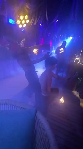 Fire dancers perform nighttime show at Thailand beach venue
