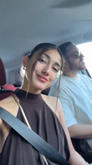 Woman smiles for camera in car in Montenegro