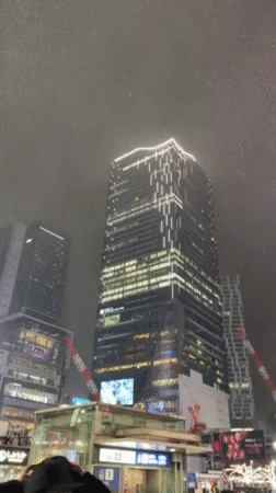 Snow or rain falls in Shibuya district, Tokyo