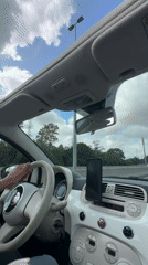 Passenger-seat view from a Fiat 500 cruising a Belgian highway