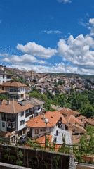 Scenic hillside town with red roofs captured on video